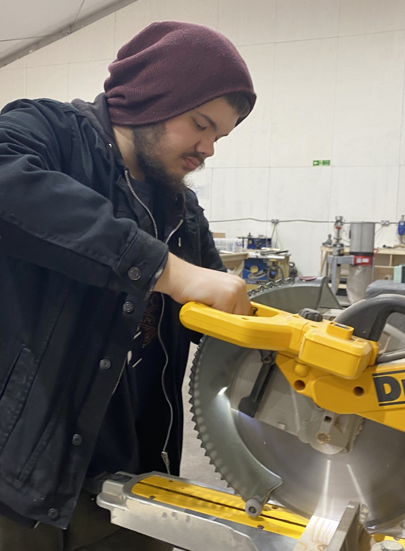 An image showing TV Production graduate James Hunt working with some machinery